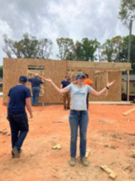 Lt Caitlin Pessolano doing volunteer construction work
