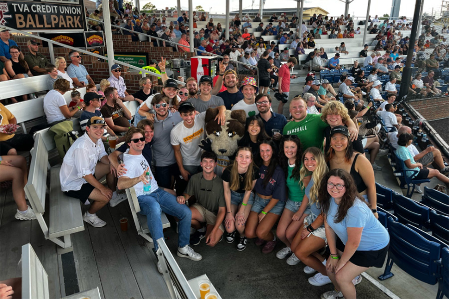 Sam Howell at local baseball game with fellow interns
