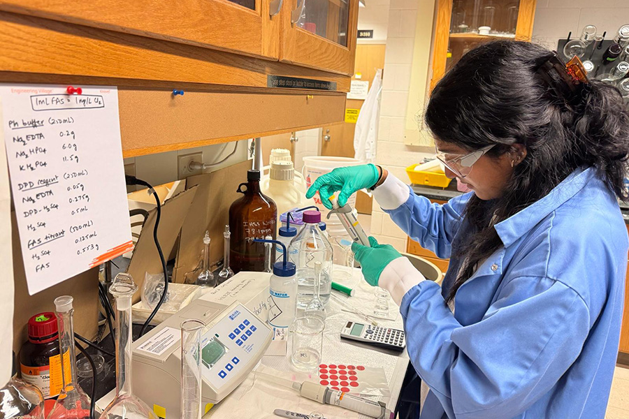 Rashmika Manipati working in a research lab at Purdue.