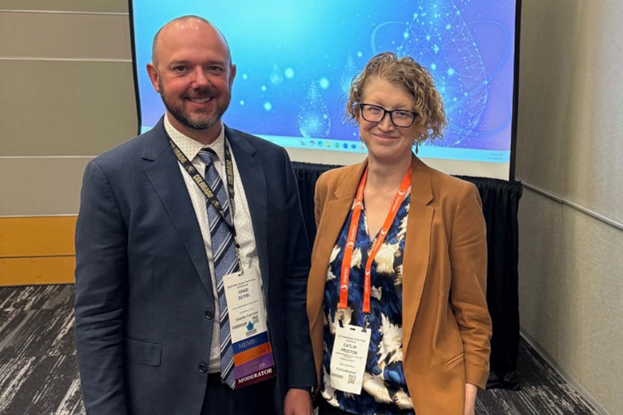 From Left to Right, Chad Siedel (from Corona Environmental) and Dr. Caitlin Proctor at the AWWA Water Quality Technology Conference.  