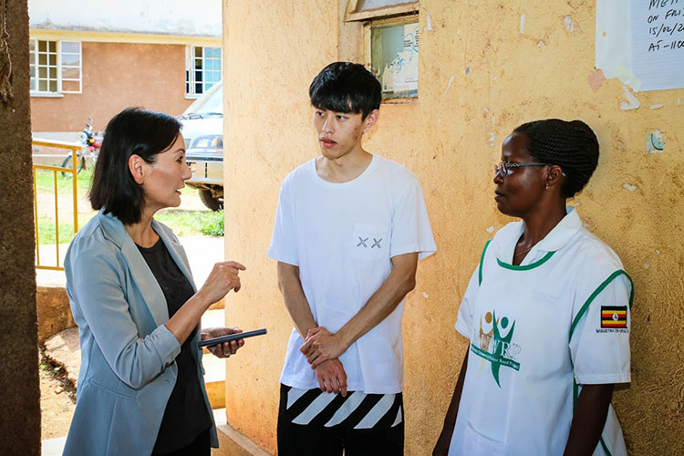 Photo of Dawei Wang & Yuehwern Yih w/nurse in Uganda