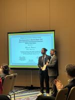 Ricardo receiving the award from Chair of AEP35, Dr. Giovanni Circella