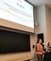 Photo of Zairelys Reyes-Rivera presenting poster