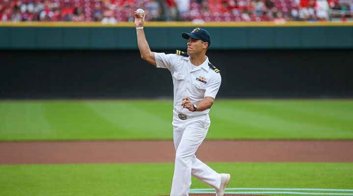 Santino Alteri at baseball stadium throwing out pitch