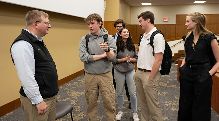 Joseph Jewel talking to students