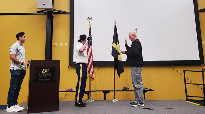 Nicholas Harrell being promoted to major