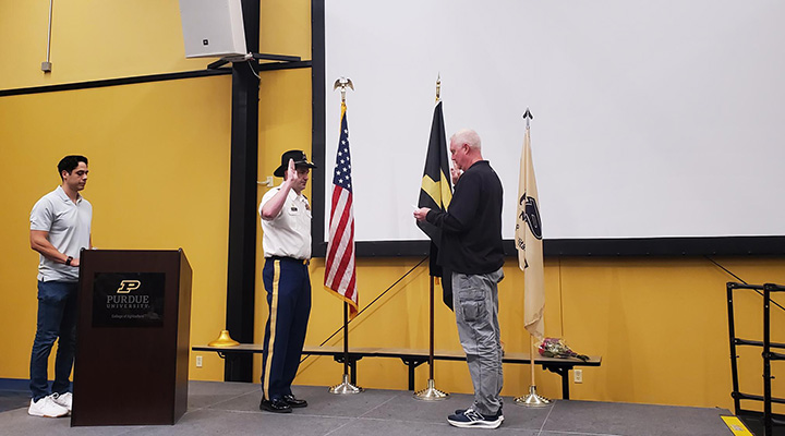 Nicholas Harrell being promoted to major