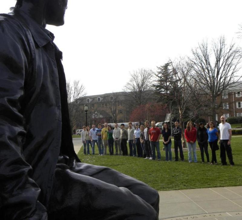 The research group under the Neil Armstrong portrait in Armstrong Hall, December 2012. Left to right: Tom Pavlak, Mar Vaquero, Wayne Schlei, Davide Guzzetti, Cody Short, Lucia Capdevila, Loic Chappaz, Masaki Kakoi, Galen Harden, Chris Geisel, Amanda Knutson, Ted Wahl, Chris Spreen, Tash Bosanac, Rohan Sood, Amanda Haapala, Bonnie Prado Pino, Ash Das, and Jeff Stuart.