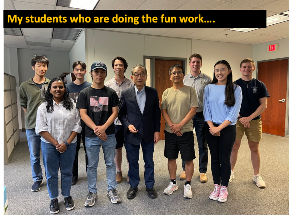 A group of people posing for a photo
Description automatically generated