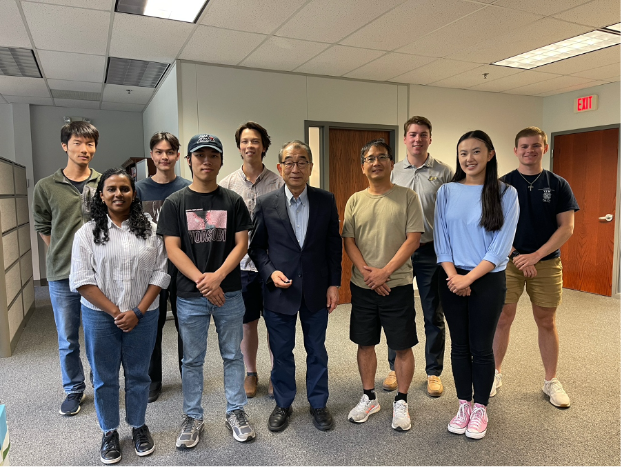 A group of people posing for a photo
Description automatically generated